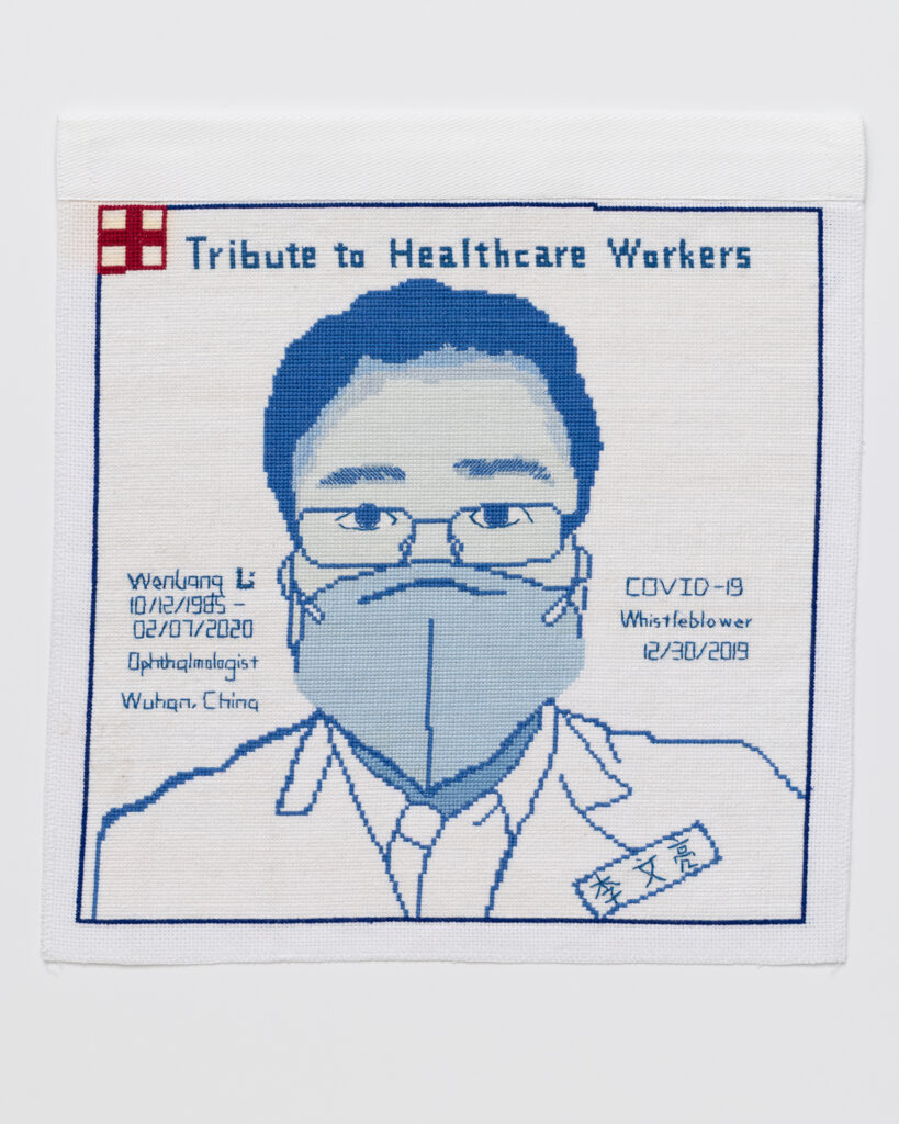 Cross stitch embroidered portrait of Dr. WenLiang Li. His name is stitched to the left of his image, along with 