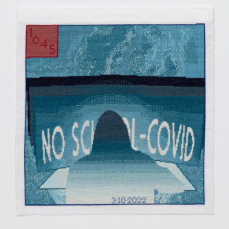 Photo by Wes Magyar Cross stitch embroidery of back of person with long hair sitting at a desk, in front of a screen. On the screen is written "NO SCHOOL-COVID" The embroidery is varying colors of blue/teal, with a red square in the upper left corner. "3/10/2022" is written across the bottom middle of the image.